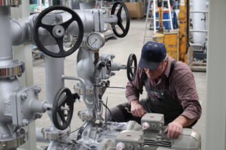AURA technician forming pipework