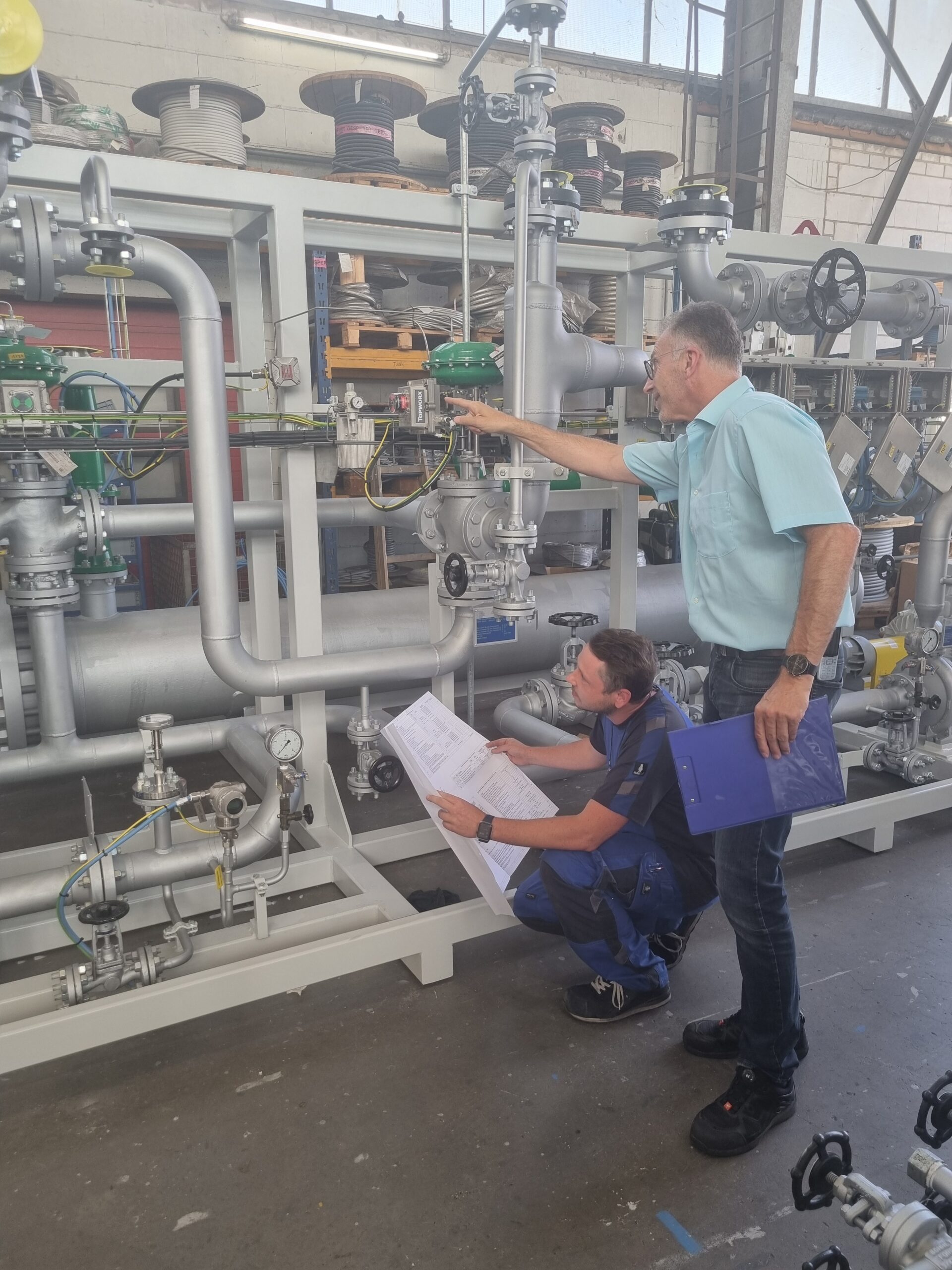 AURA engineers inspecting a process heating system – quality management